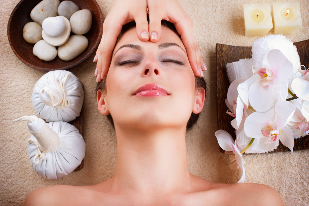 Relaxed woman receiving spa treatments